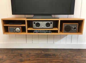 White oak floating TV and video console. Wall mounted media cabinet.