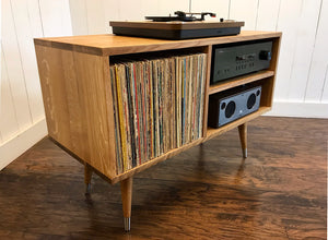 Solid white oak turntable and stereo console with album storage.