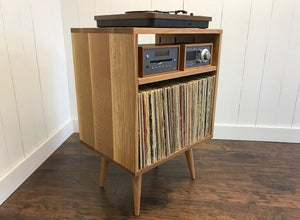Solid white oak vertical turntable and stereo console with album storage.