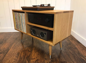 Solid white oak turntable and stereo console with album storage.