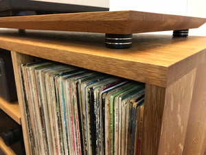 Solid white oak turntable/stereo console with isolation platform and album storage.