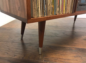 Solid mahogany turntable and stereo console with album storage.