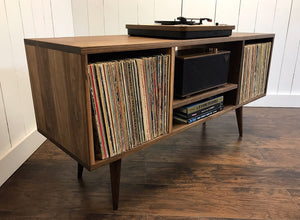 Solid walnut turntable and stereo console with album storage.