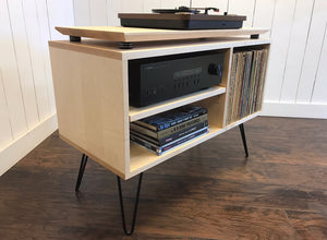 Solid maple turntable/stereo console with isolation platform and album storage.