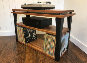 Mahogany stereo and turntable console with album storage.