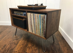 Solid walnut record player and stereo cabinet with album storage.