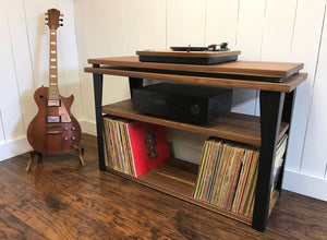 Walnut stereo and turntable console with album storage.