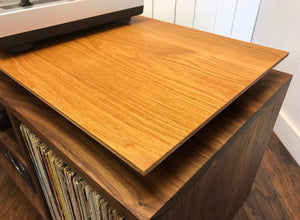 Solid walnut and white oak turntable/stereo console with isolation platform and album storage.