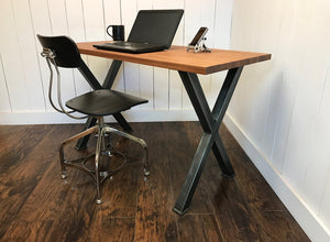 Modern industrial desk, solid mahogany top with steel legs.
