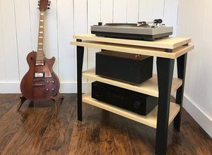 Maple stereo and turntable console with album storage.