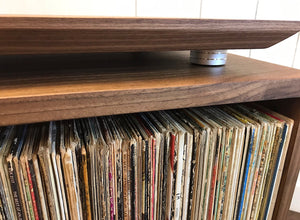 Solid walnut turntable and stereo console with isolation platform and album storage.