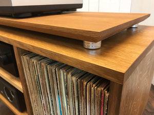 Solid white oak turntable/stereo console with isolation platform and album storage.